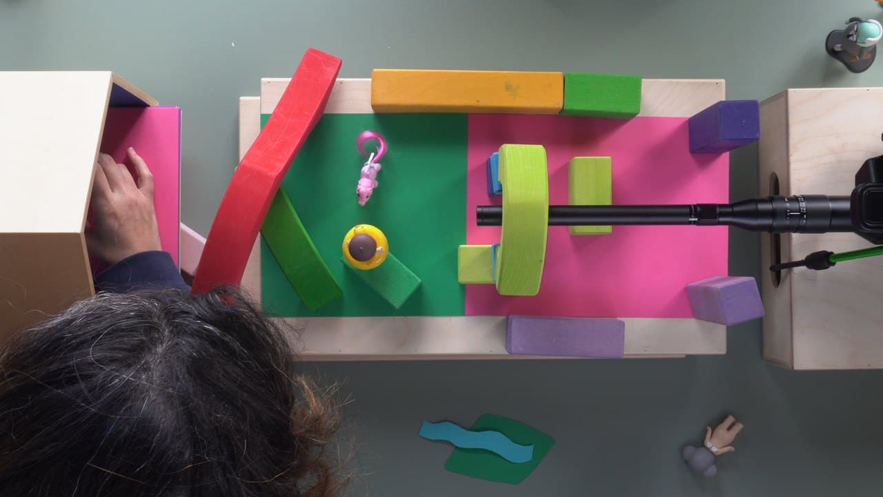 Overhead view of a colorful set built from blocks and paper